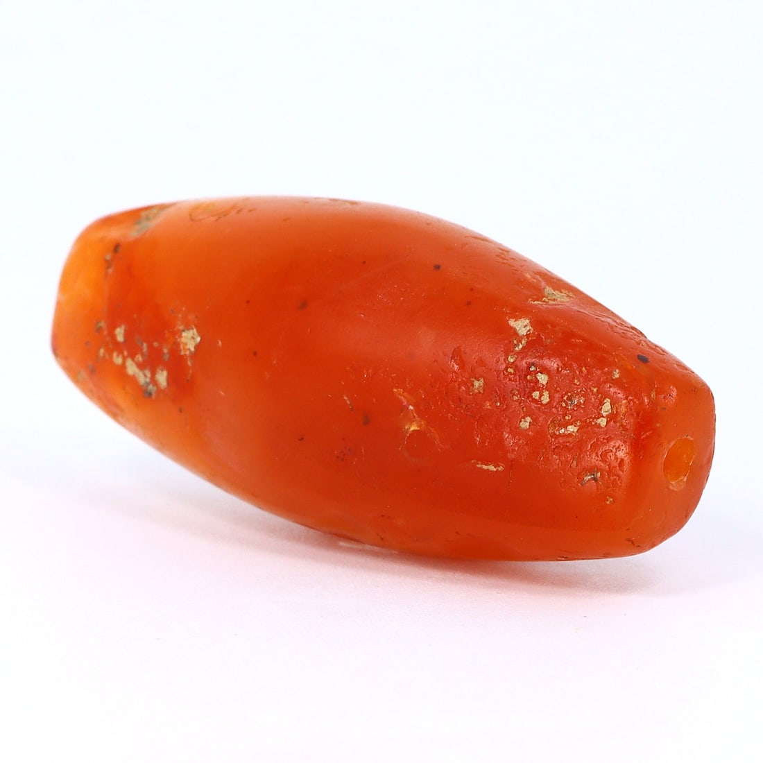 Antique Flatten Carnelian Bead, Himalayan (1650 AD - 1800 AD): Dimension: 34.7x12.3mm "Journey Through Time: Ancient Bronze Age Beads, Sculpture, and Ornaments, Featuring Himalayan Tibetan Agate Carnelian Dzi Beads" Unearth the timeless allure of ancient beads, s
