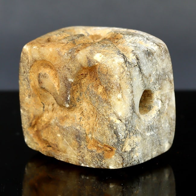 Quartet of Antiquity: The Four Faces Marble Seal of Uruk: Dimension: 20x15mm The ancient city of Uruk, located in what is now modern-day Iraq, is often hailed as one of the world's first cities, a cradle of civilization. From the heart of this ancient metrop