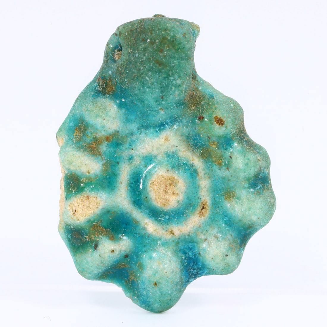 Sacred Symbols: The Faience Amulet Locket of Ancient Egypt's New Kingdom: Dimension: 35x25mm The New Kingdom period of ancient Egypt, spanning from 1550 BC to 1077 BC, stands out as a pinnacle of cultural, religious, and architectural achievements. Among the many intricate 