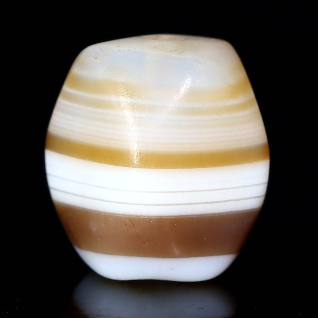 Antique Banded Agate Dzi Bead, Himalayan (1650 AD - 1800 AD): Dimension: 9x6.6mm "Journey Through Time: Ancient Bronze Age Beads, Sculpture, and Ornaments, Featuring Himalayan Tibetan Agate Carnelian Dzi Beads" Unearth the timeless allure of ancient beads, sculp