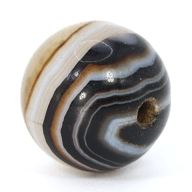 Antique Banded Agate Dzi Bead, Himalayan (1650 AD - 1800 AD): Dimension: 10.5mm "Journey Through Time: Ancient Bronze Age Beads, Sculpture, and Ornaments, Featuring Himalayan Tibetan Agate Carnelian Dzi Beads" Unearth the timeless allure of ancient beads, sculpt