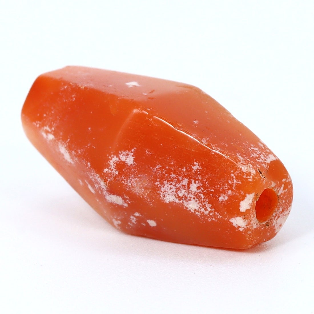 Ancient Faceted Carnelian Bead, Greco-Bactrian Kingdom (3rdC BC - 2ndC BC): Bead Dimension: 20.3x9.7mm in size Discover the Timeless Beauty of Ancient Beads with Thousand Planet Auction House Beneath the sands of history lie treasures that transcend time-ancient beads that be