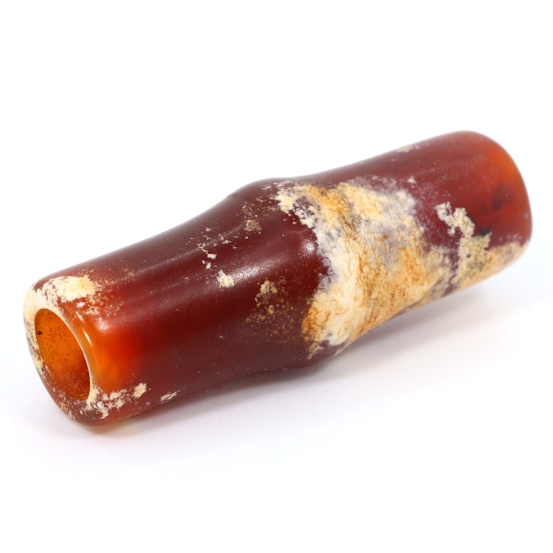 Ancient Carnelian Bead, Greco-Bactrian Kingdom (3rdC BC - 2ndC BC): Bead Dimension: 29.7x10.8mm in size Discover the Timeless Beauty of Ancient Beads with Thousand Planet Auction House Beneath the sands of history lie treasures that transcend time-ancient beads that b