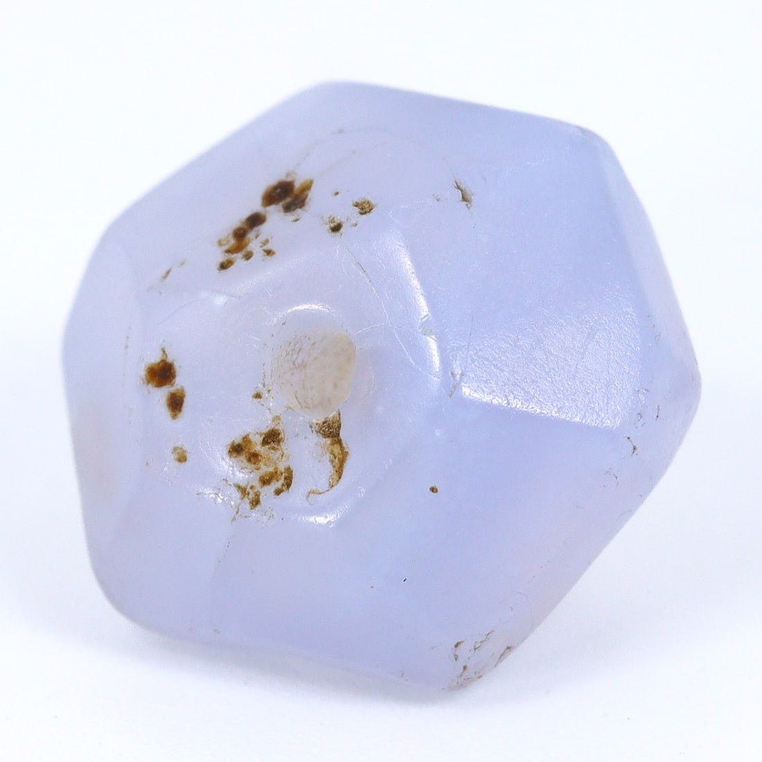 Ancient Faceted Hexagonal Chalcedony Bead, Roman Empire (27 BC - 476 AD): Bead Dimension: 12x11mm in size Discover the Timeless Beauty of Ancient Beads with Thousand Planet Auction House Beneath the sands of history lie treasures that transcend time-ancient beads that bear 
