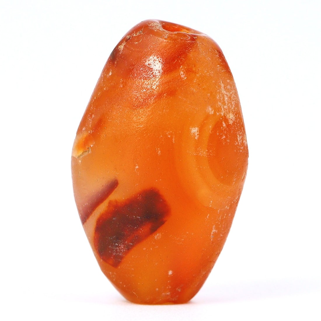 Ancient Carnelian Agate Bead, Indus Valley (3300 BC - 1300 BC): Dimension: 17x10.4mm "Journey Through Time: Ancient Bronze Age Beads, Sculpture, and Ornaments, Featuring Himalayan Tibetan Agate Carnelian Dzi Beads" Unearth the timeless allure of ancient beads, scu