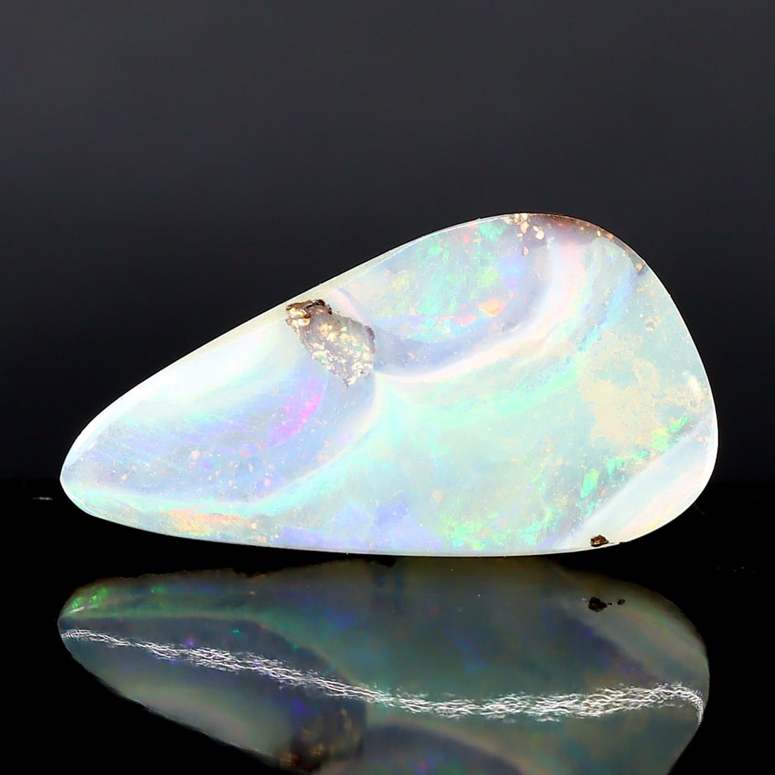 Australian Koroit Matrix Boulder Opal: Vibrant Tapestry of Nature's Brilliance: Dimension: 17x9x4mm Weight: 4Ct Estimate: $220-$460 In recent auctions, Australian Koroit Matrix Boulder Opals have witnessed an increasing demand. An opal of similar quality and pattern was auctioned