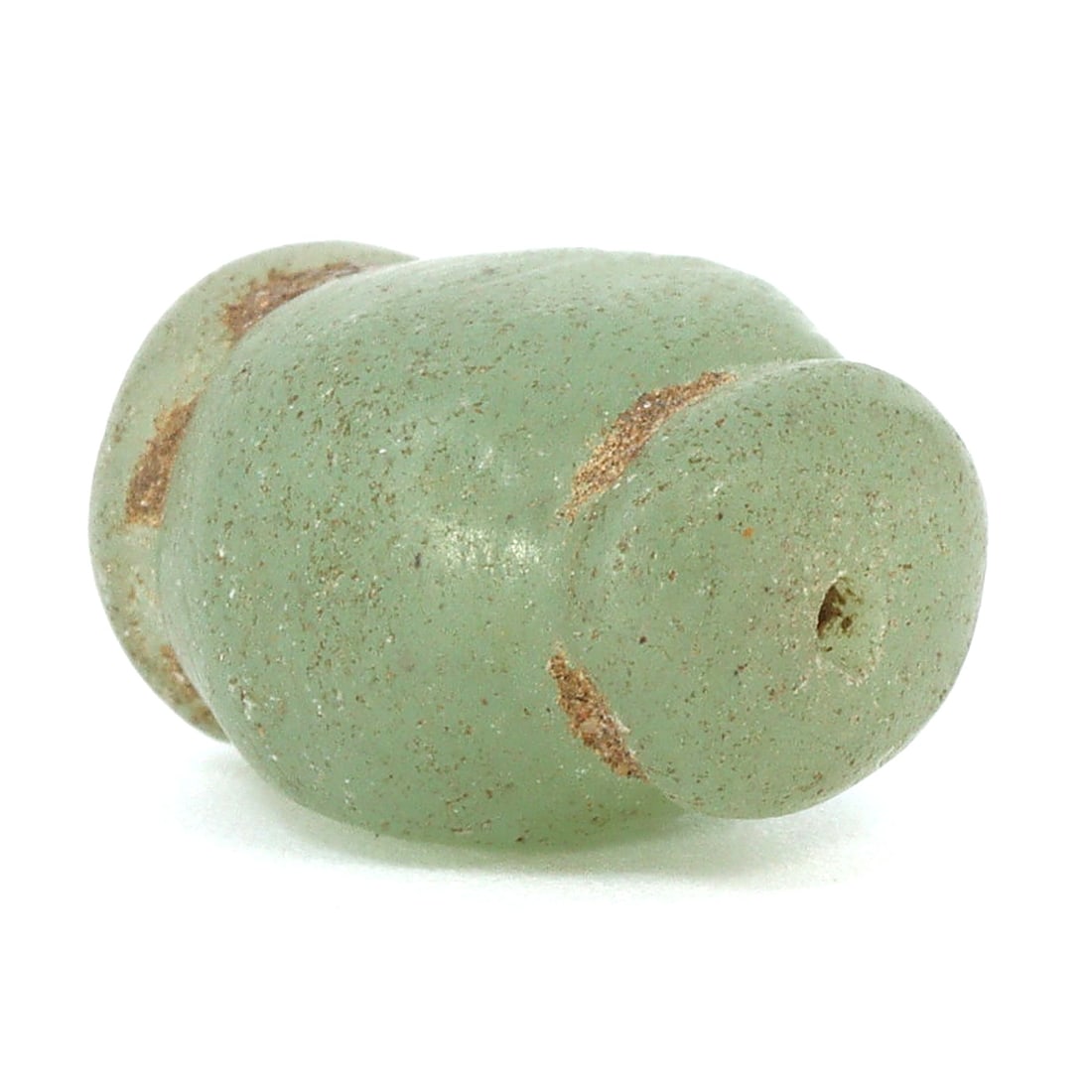Echoes of Bygone Times: Lustrous Green Bead of Ancient Southeast Asia (800-1500 AD): Dimension: 12x10mm Rarity Level: High Rarity Given its rich historical significance and its age spanning from 800-1500 AD, this bead is a rare find, especially in its preserved condition. Estimate: $6