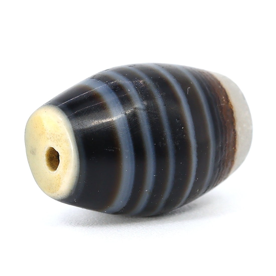 Islamic Age Banded Agate Elegance: Time's Treasured Tale (8th-13th Century): Dimension: 13x8mm Rarity Level: Exceptional Rarity Given its roots in the Islamic epoch, the age and historical background make it a significantly rare artifact. Estimate: $250-$450 Remark: Considerin