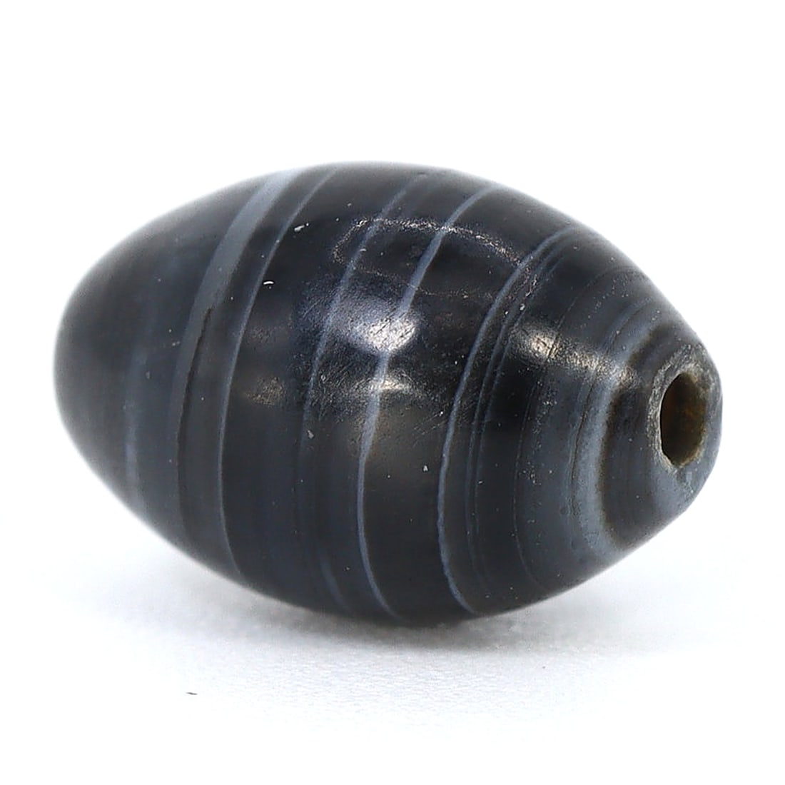Resplendent Banded Agate Artifact: Touch of the Islamic Epoch (8th-13th Century): Dimension: 8.8x6mm Rarity Level: Exceptional Rarity Given its roots in the Islamic epoch, the age and historical background make it a significantly rare artifact. Estimate: $250-$450 Remark: Consideri