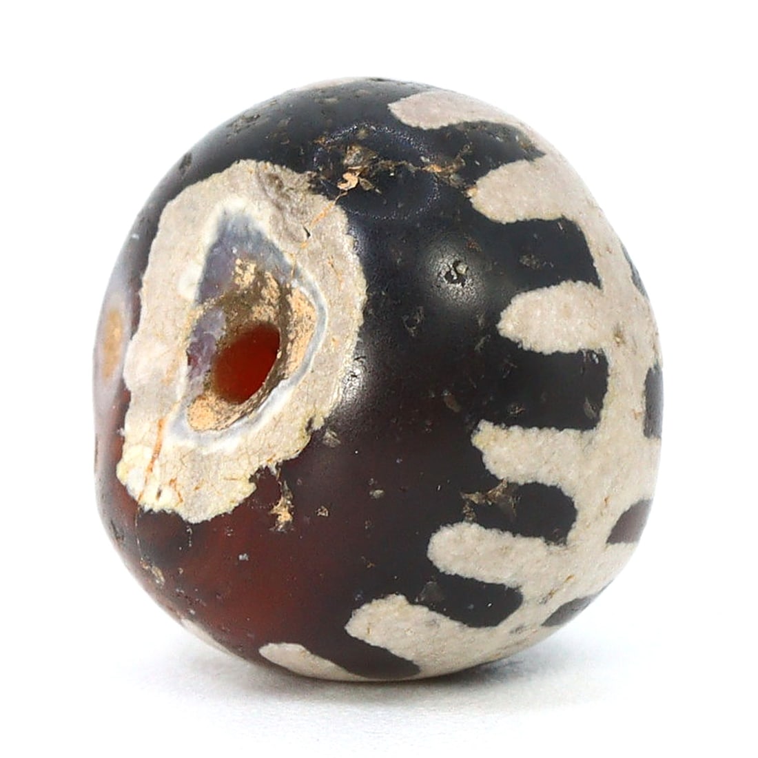 Ancient Pyu Civilization Etched Carnelian Bead, 2nd Century BCE - 9th Century CE: Dimension: 11x8.8mm Rarity Level: Highly Rare This bead, stemming from the Pyu era, represents a unique piece of history from an ancient civilization that existed nearly two millennia ago. Estimate: $