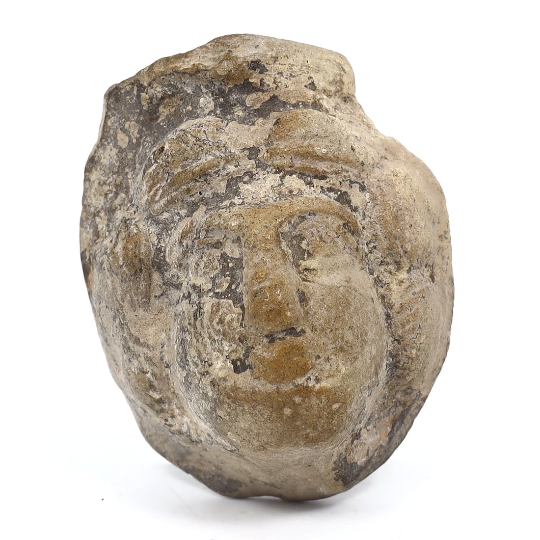Ancient Greek Male Terracotta Head: Echoes of the Archaic Period (8thC BC - 6thC BC): Dimension: 40x30mm Rarity Level: Extremely Rare Representing the illustrious Archaic Period of Ancient Greece, this terracotta head serves as a testament to the profound artistry and sculptural prowes
