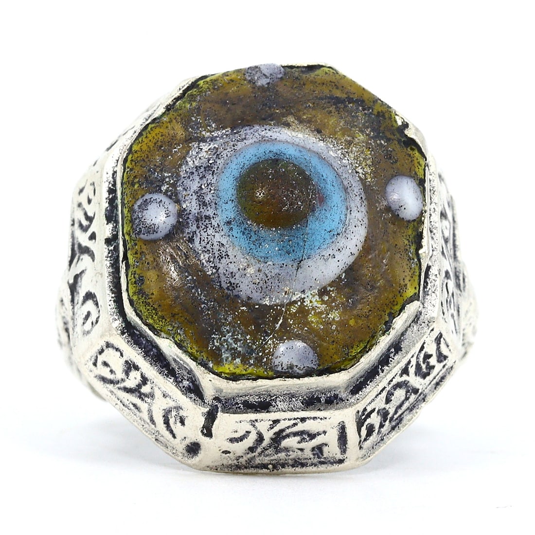 20th Century Ring with Gilt Design and Islamic-Inspired Glass Bead (Mid-Century 20th Century): Ring size: US 7.5 Rarity Level: Highly Rare Owing to its symbolic ties with the Islamic Era and the impeccable craftsmanship of the glass bead, this ring is not just an emblem of history but also a te