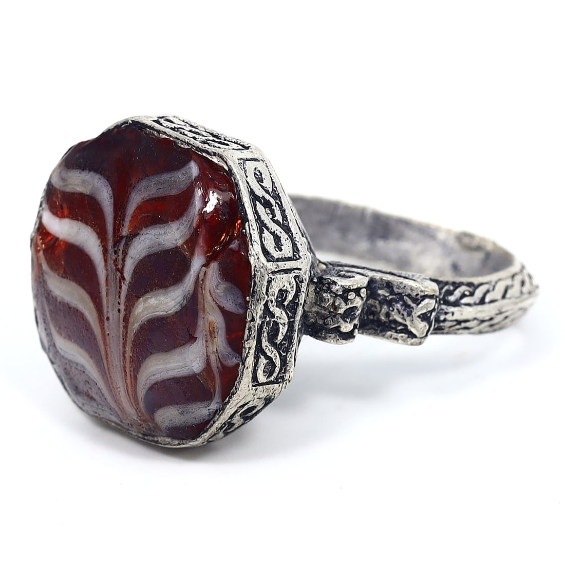 Classic 20th Century Gilt Band Adorned with Islamic Pattern Glass Bead: Ring size: US 8 Rarity Level: Highly Rare Owing to its symbolic ties with the Islamic Era and the impeccable craftsmanship of the glass bead, this ring is not just an emblem of history but also a test