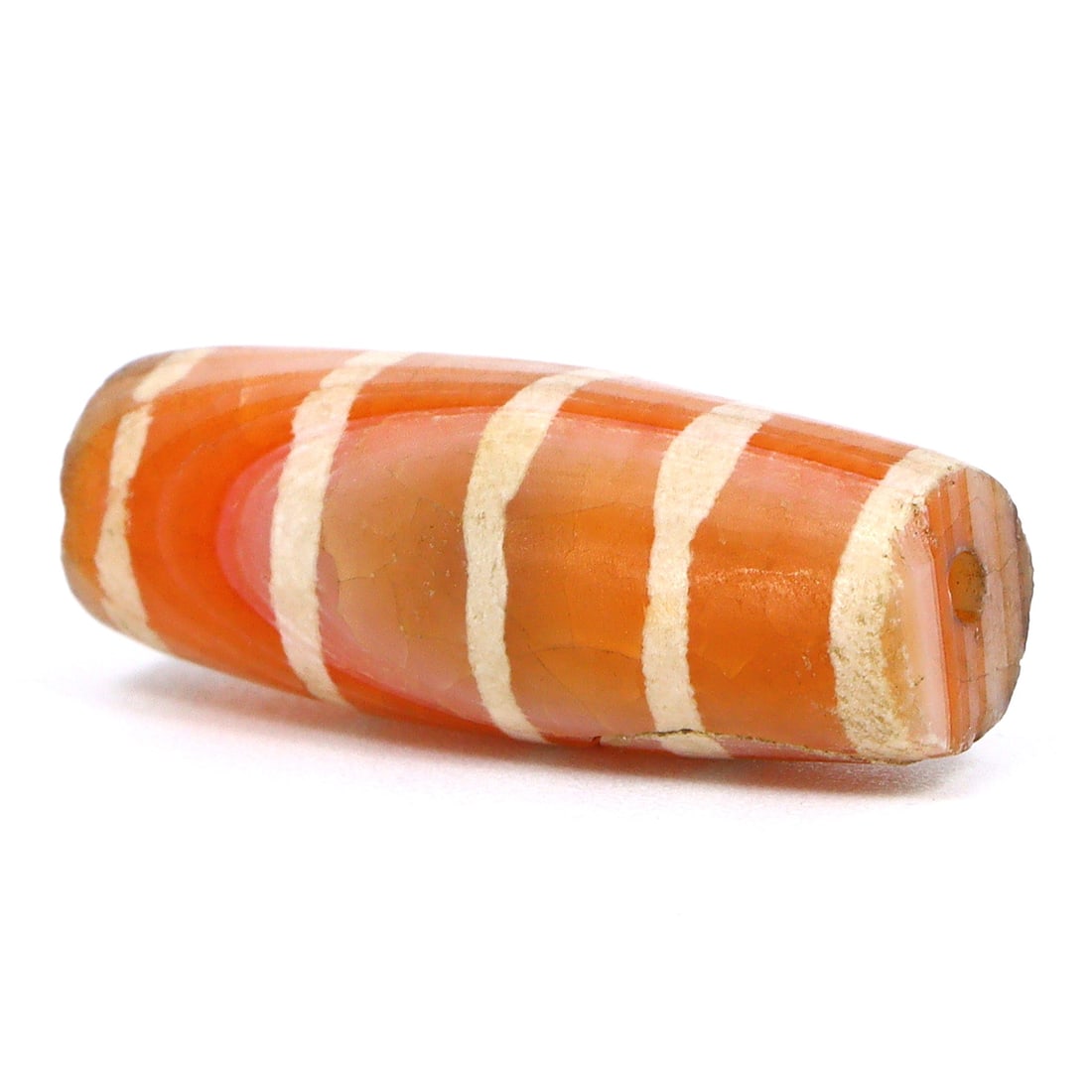 Pyu Craftsmanship: Historical Etched Carnelian dZi Bead, 2nd Century BCE - 9th Century CE: Dimension: 20.5x7.5mm Rarity Level: Highly Rare This bead, stemming from the Pyu era, represents a unique piece of history from an ancient civilization that existed nearly two millennia ago. Estimate: