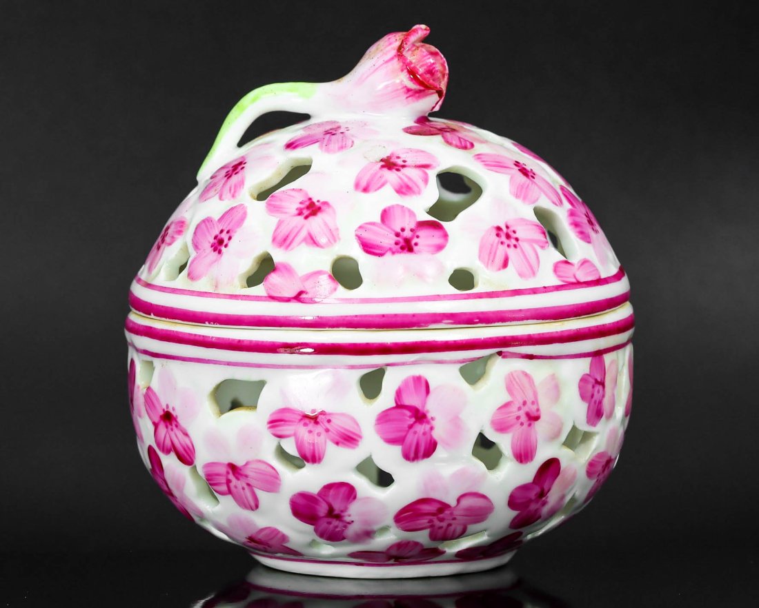 Floral Pink & White Pierced Bowl: European Rococo Style Royal Porcelain: Dimension: 9x7.5cm Weight: 125gram Introduction: Elegance personified, this European Rococo style pierced bowl manifests the epitome of porcelain artistry. Cloaked in soft pink hues, it's adorned with