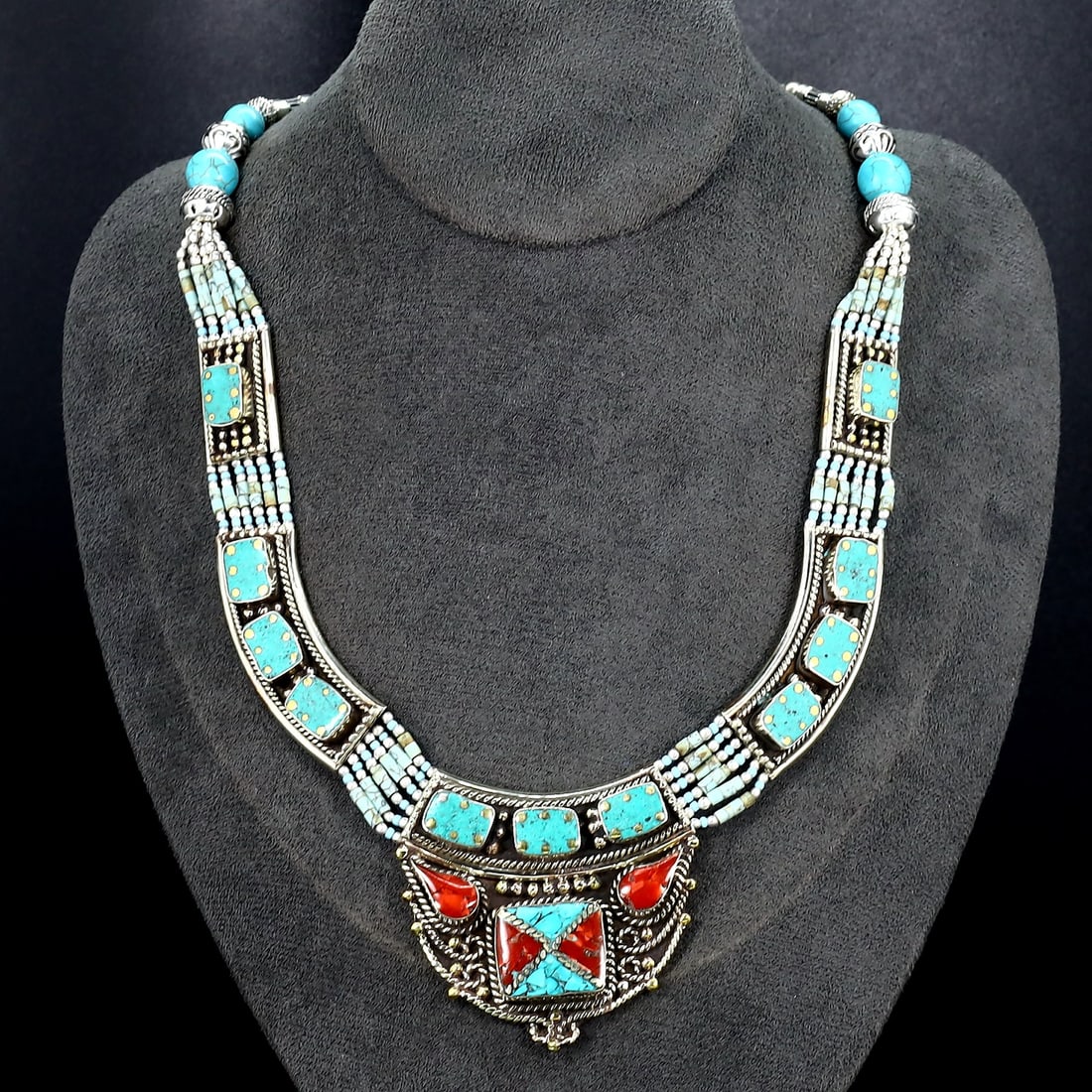 Vintage Tibetan Necklace: An Ode to Tibetan Artistry (Mid-20th Century): Dimension: 18" inches Weight: 124 gram Introduction: Discover a captivating piece of history, the Authentic Vintage Tibetan Pendant adorned with Tribal Silver and Colorful Inlay. This remarkable penda