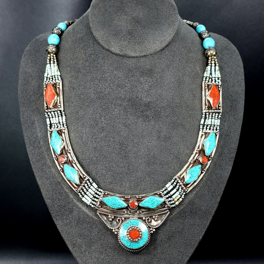 Vintage Tibetan Necklace: An Ode to Tibetan Artistry (Mid-20th Century): Dimension: 18" inches Weight: 136 gram Introduction: Discover a captivating piece of history, the Authentic Vintage Tibetan Pendant adorned with Tribal Silver and Colorful Inlay. This remarkable penda