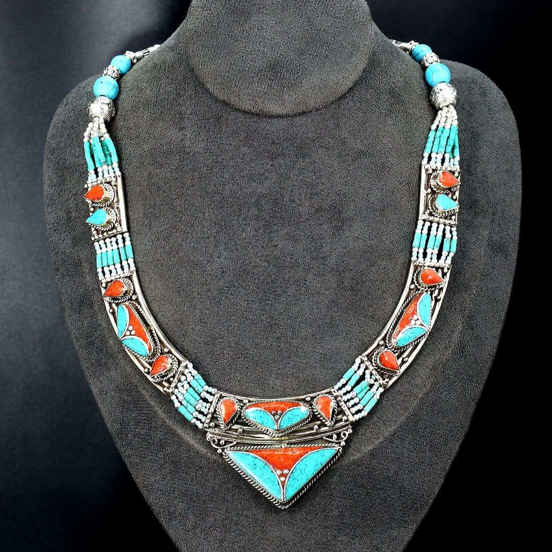 Vintage Tibetan Necklace: An Ode to Tibetan Artistry (Mid-20th Century): Dimension: 19" inches Weight: 140 gram Introduction: Discover a captivating piece of history, the Authentic Vintage Tibetan Pendant adorned with Tribal Silver and Colorful Inlay. This remarkable penda