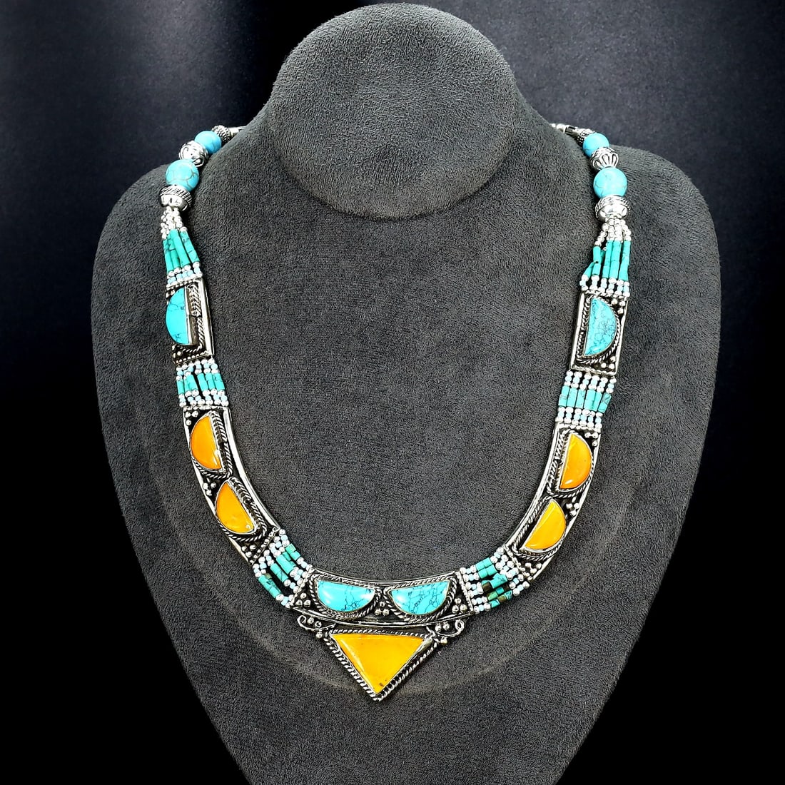 Vintage Tibetan Necklace: An Ode to Tibetan Artistry (Mid-20th Century): Dimension: 19" inches Weight: 125 gram Introduction: Discover a captivating piece of history, the Authentic Vintage Tibetan Pendant adorned with Tribal Silver and Colorful Inlay. This remarkable penda