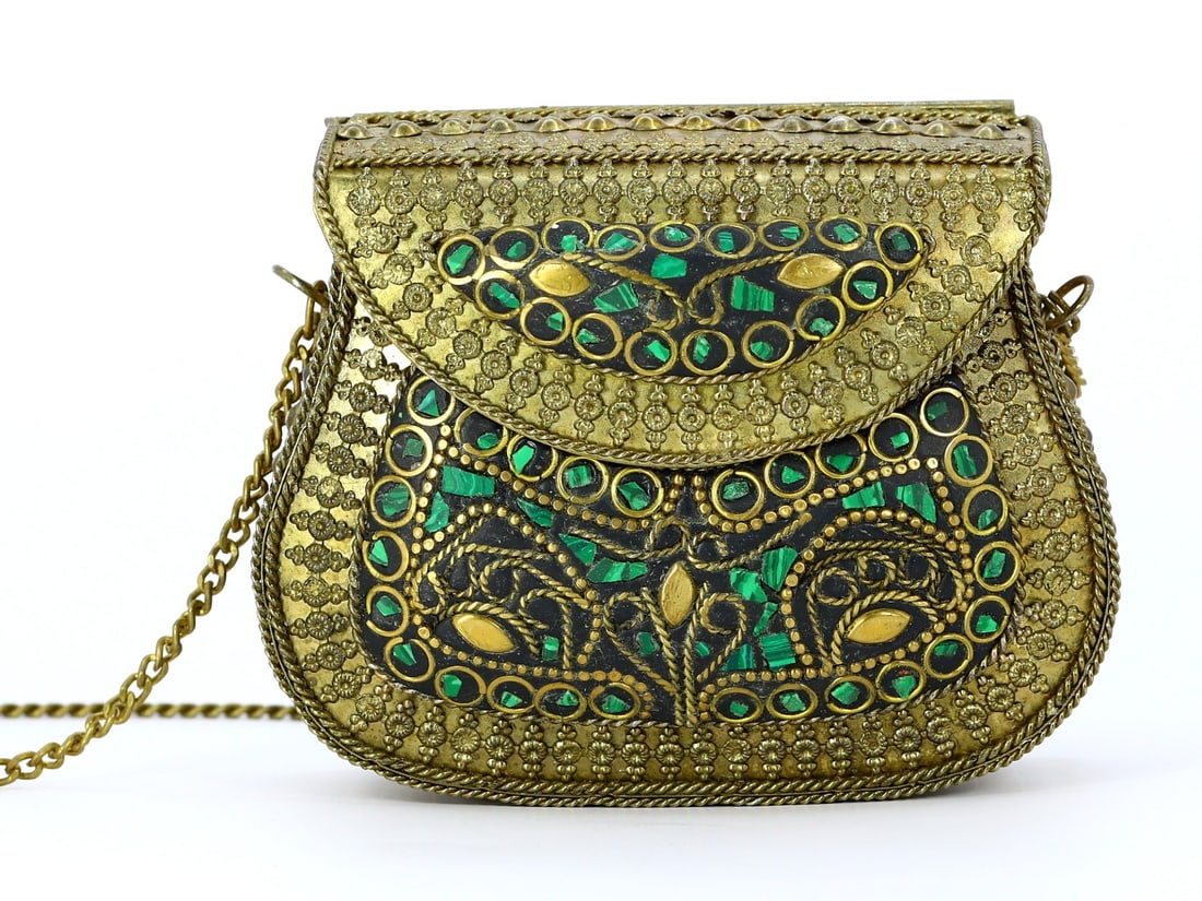 Vintage Tibetan Malachite Inlay Brass Shoulder Bag: A Fusion of Elegance and Craft: Dimension: 10x8cm Weight: 187.3gram Introduction: This vintage Tibetan shoulder bag, intricately adorned with malachite green chips inlay on brass, is a testament to the rich artisanal traditions of t