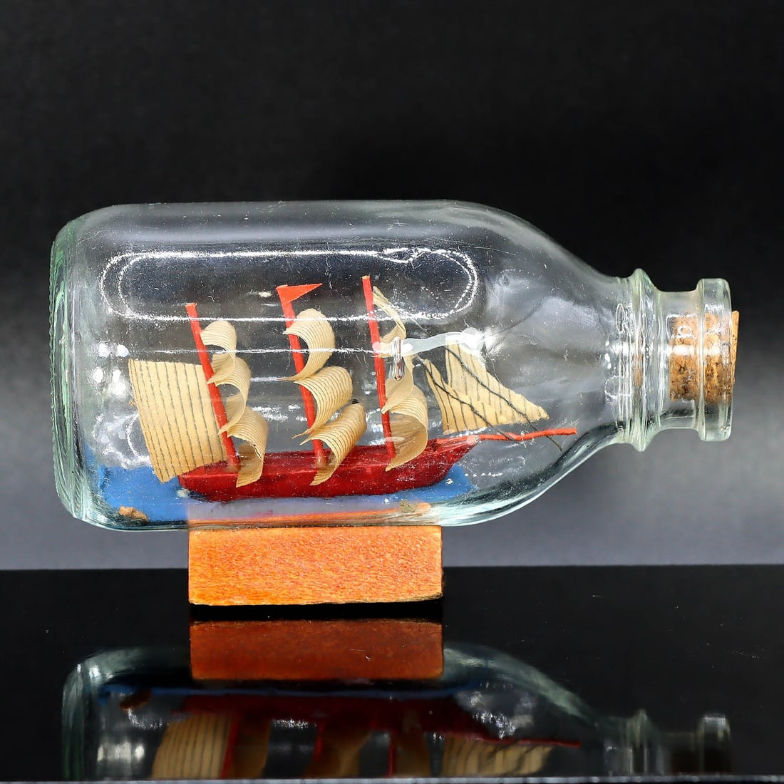 Okinawan Maritime Mastery: Ship in a Bottle - A Captivating Tribute to Island's Seafaring Heritage: Dimension: 11x6cm Weight: 130gram Introduction: This ship in a bottle is a charming representation of Okinawan art, a unique and fascinating genre of Japanese craftsmanship. The model ship, meticulous