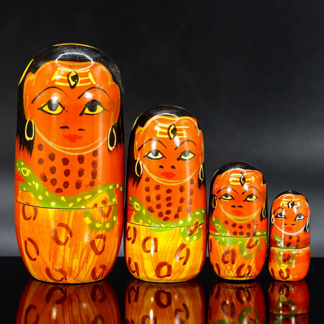 Japanese Showa Era Style Nesting Doll: Vibrant Orange Wood Doll Set with Character: Dimensions: 9x4 cm Weight: 64 grams Introduction: Embrace the whimsical charm of Japanese culture with this set of Orange wooden nesting dolls, each gracing a delightful character's face. These dolls