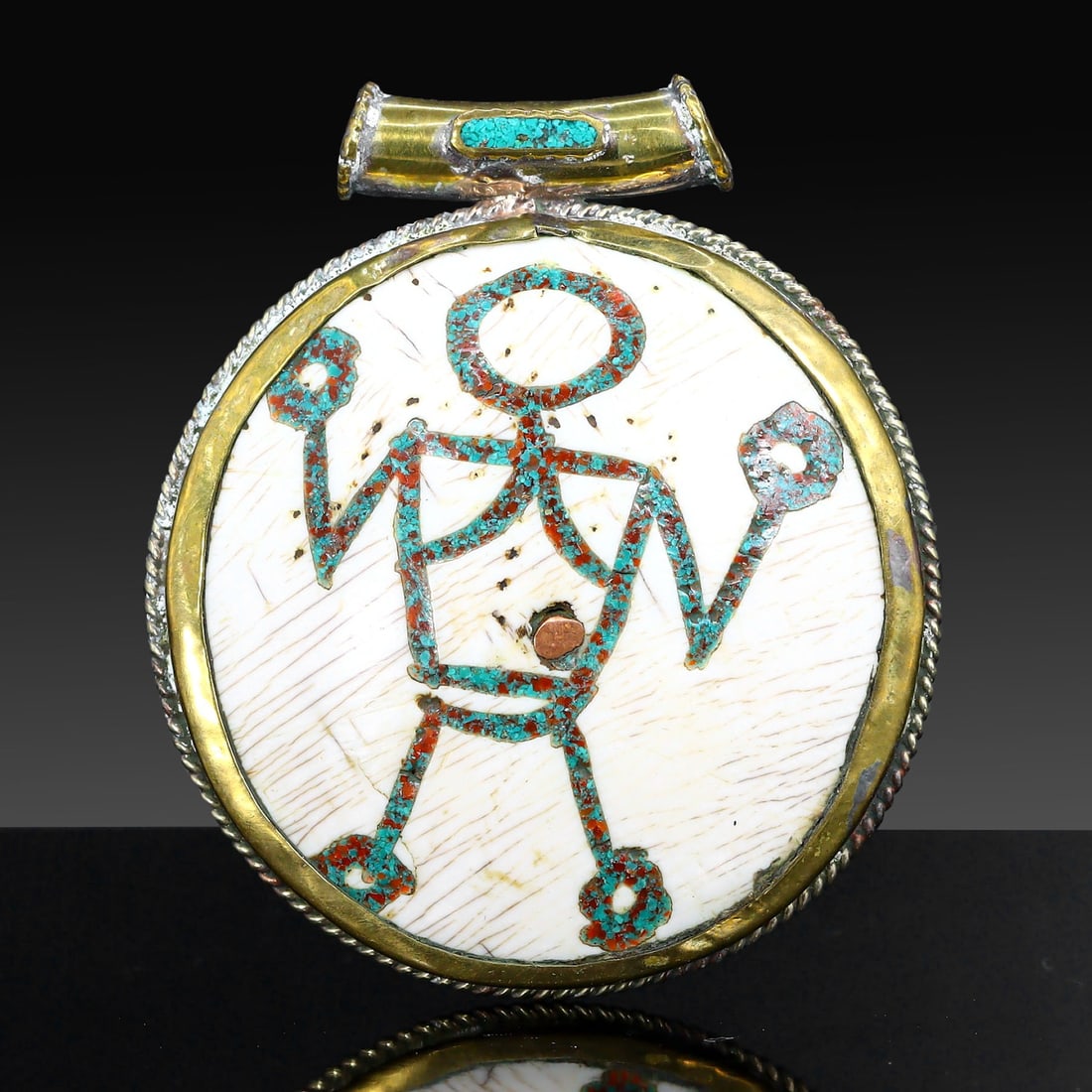 Authentic Vintage Tibetan Pendant Locket with Brass and Colorful Inlay: Dimension: 6.5x5.5cm Weight: 54gram Introduction: Discover a captivating piece of history, the Authentic Vintage Tibetan Pendant adorned with Tribal and Colorful Inlay. This remarkable pendant carries
