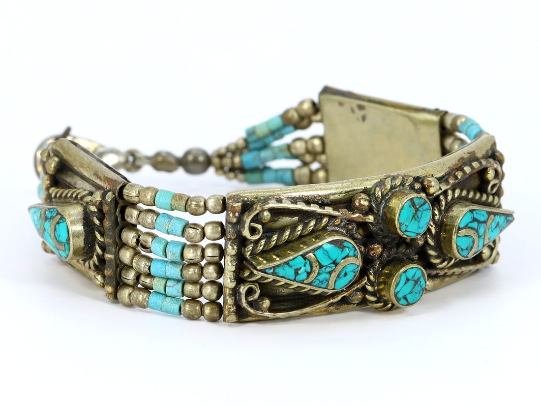 Authentic Vintage Tibetan Bangle with Tribal Silver and Colorful Inlay: Dimension: 7.3" inches Weight: 37gram Introduction: Behold an extraordinary piece of history, the Authentic Vintage Tibetan Bangle with Tribal Silver and Colorful Inlay. This remarkable bangle carries