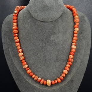 Old Tibetan Handcrafted Red Coral Bead Necklace: Dimension: 51 cm (20 inches) Weight: 53 grams Introduction: This exquisite necklace showcases old Tibetan red coral beads, a treasure of the Himalayas. The deep red hues and organic shapes of the bead