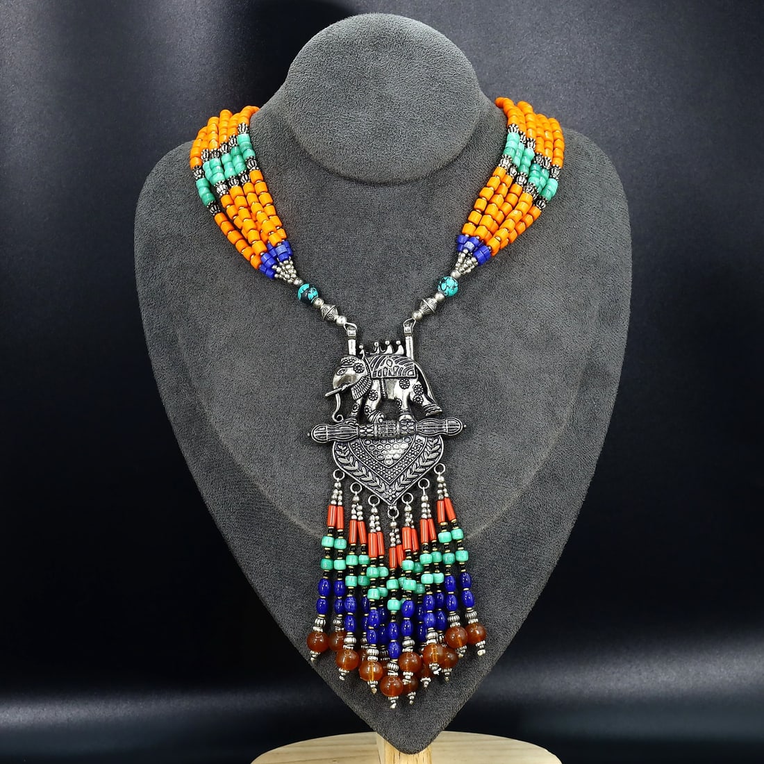 Vintage Tibetan Necklace: An Ode to Tibetan Artistry (Mid-20th Century): Dimension: 25" inches Weight: 105gram Introduction: This exquisite necklace, embellished with detailed inlay work and vibrant red beads, celebrates the unmatched craftsmanship of Tibetan artisans. Dat