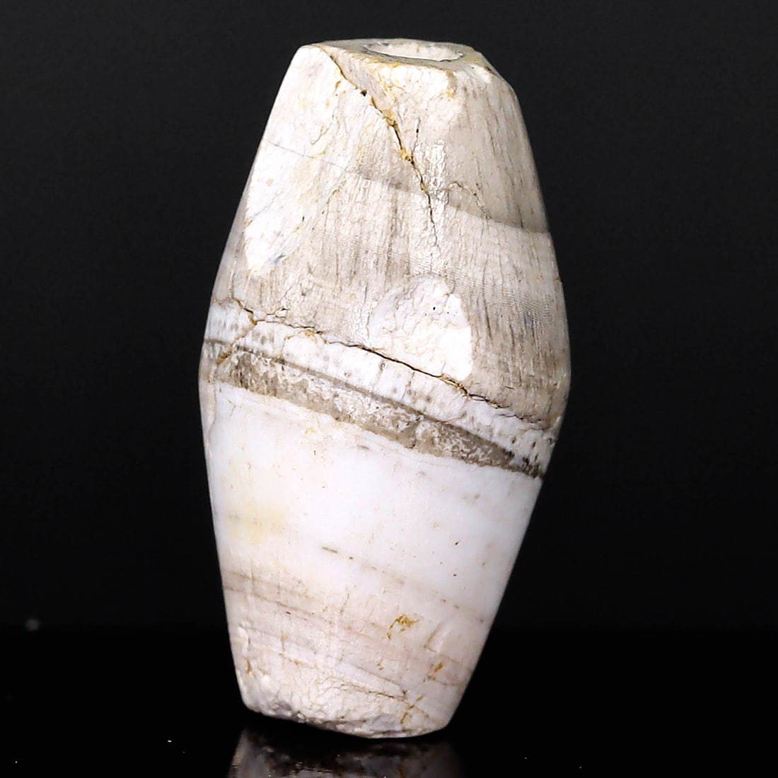 Ancient Sulemani Banded Agate Dzi Bead: Testament to Himalayan Artistry (700-500 BC): Dimension: 13.6x7mm Rarity Level: Extremely Rare This bead hails from the ancient Himalayan region of what is today Pakistan. Given its unique design, historical significance, and age, it's a relic fr