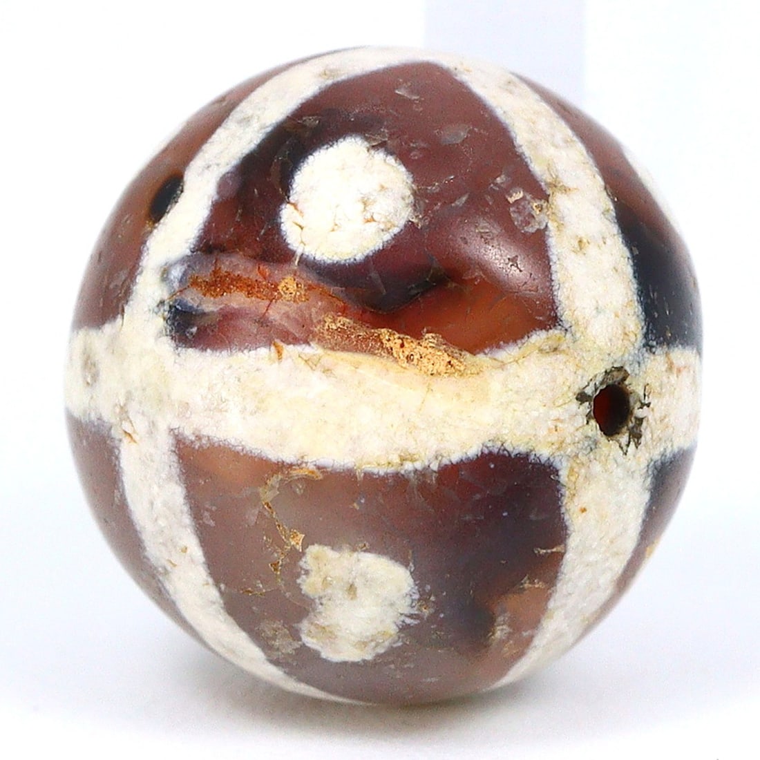 Pyu Civilization Etched Carnelian Treasure, 2nd Century BCE - 9th Century CE: Dimension: 11x10mm Rarity Level: Highly Rare This bead, stemming from the Pyu era, represents a unique piece of history from an ancient civilization that existed nearly two millennia ago. Estimate: $2