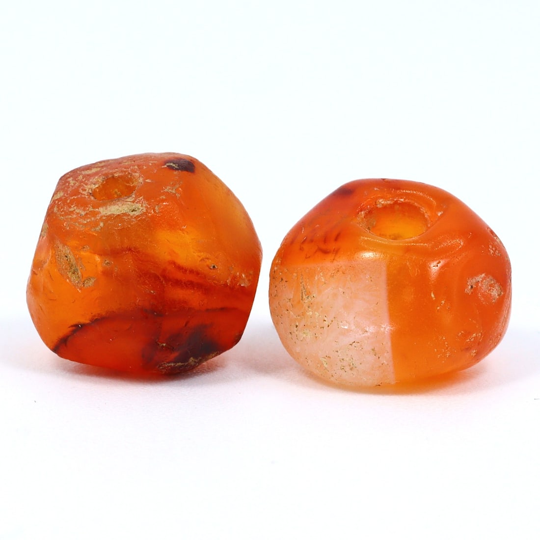 Timeless Indus Valley Carnelian Agate Artifact: Echoes of a Lost Era (2600-1900 BCE): Dimension: 9.7x9.2mm Rarity Level: Extremely Rare Given the age and historical significance, items from the Indus Valley Civilization, especially in preserved conditions, are hard to come by and are g