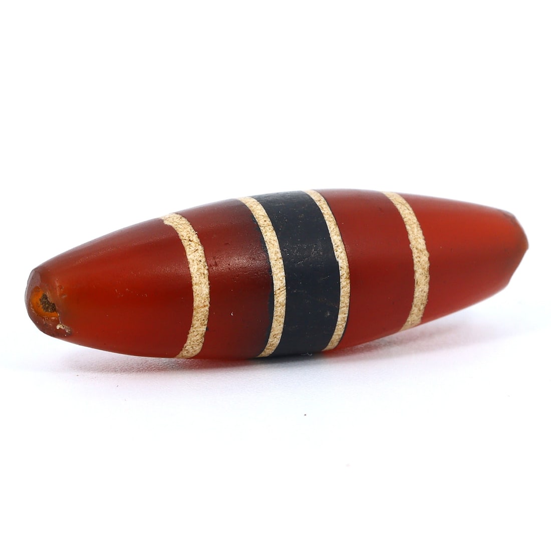 Ancient Himalayan Tibetan Carnelian Chung Dzi Bead - Enigmatic Stripes (7th-16th Century): Dimension: 29.2x8.9mm Introduction: Step back in time with this alluring ancient Tibetan Chung Dzi bead, originating from a period that spans the Tibetan Empire to the 16th century. This particular ca
