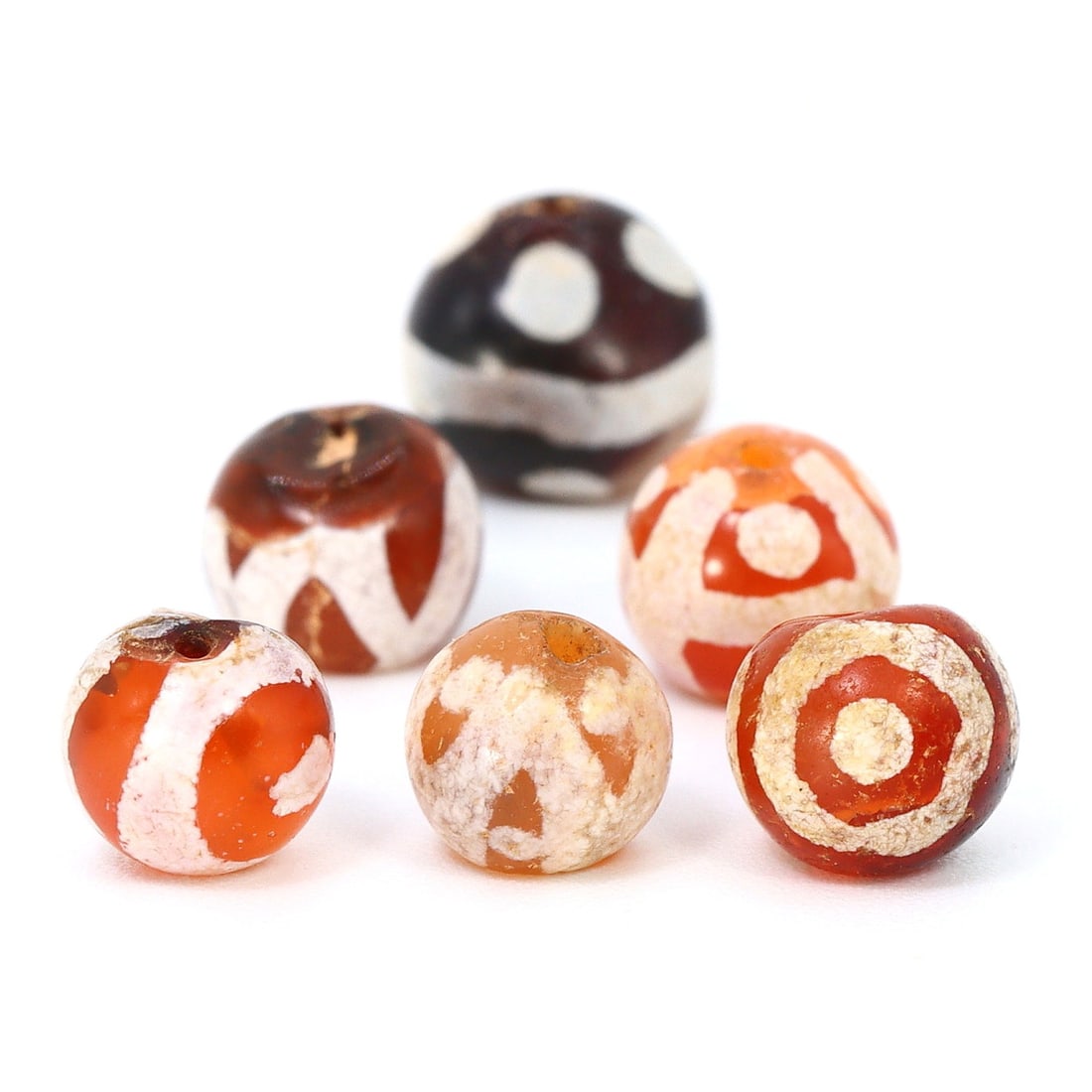 The Radiance of Pyu: Ancient Etched Carnelian Bead, 2nd Century BCE - 9th Century CE: Dimension: 5.6-7mm Rarity Level: Highly Rare This bead, stemming from the Pyu era, represents a unique piece of history from an ancient civilization that existed nearly two millennia ago. Estimate: $2