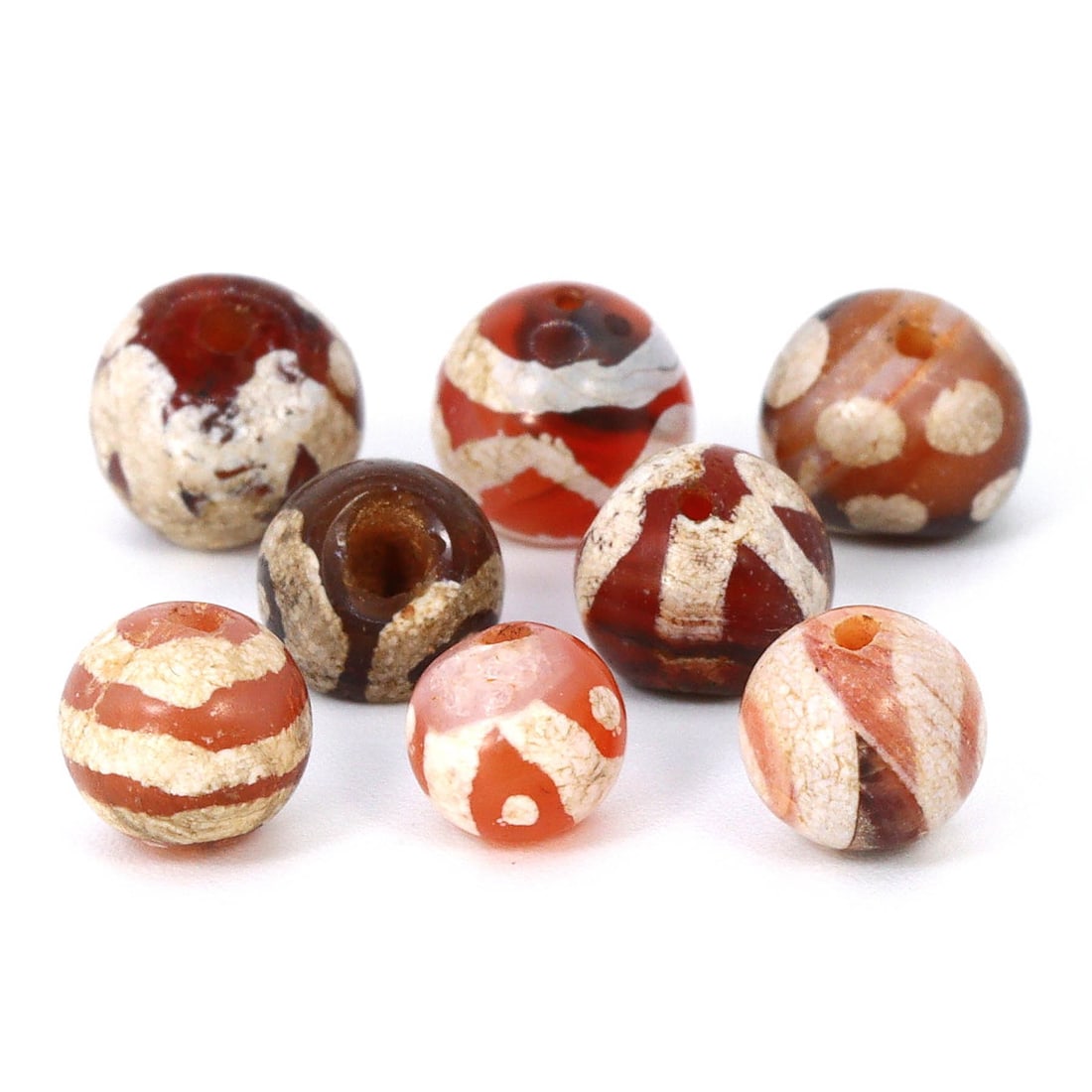 Ancient Pyu Trade Gem: Etched Carnelian dZi Beads, 2nd Century BCE - 9th Century CE: Dimension: 6.4x5.5mm Rarity Level: Highly Rare This bead, stemming from the Pyu era, represents a unique piece of history from an ancient civilization that existed nearly two millennia ago. Estimate: 