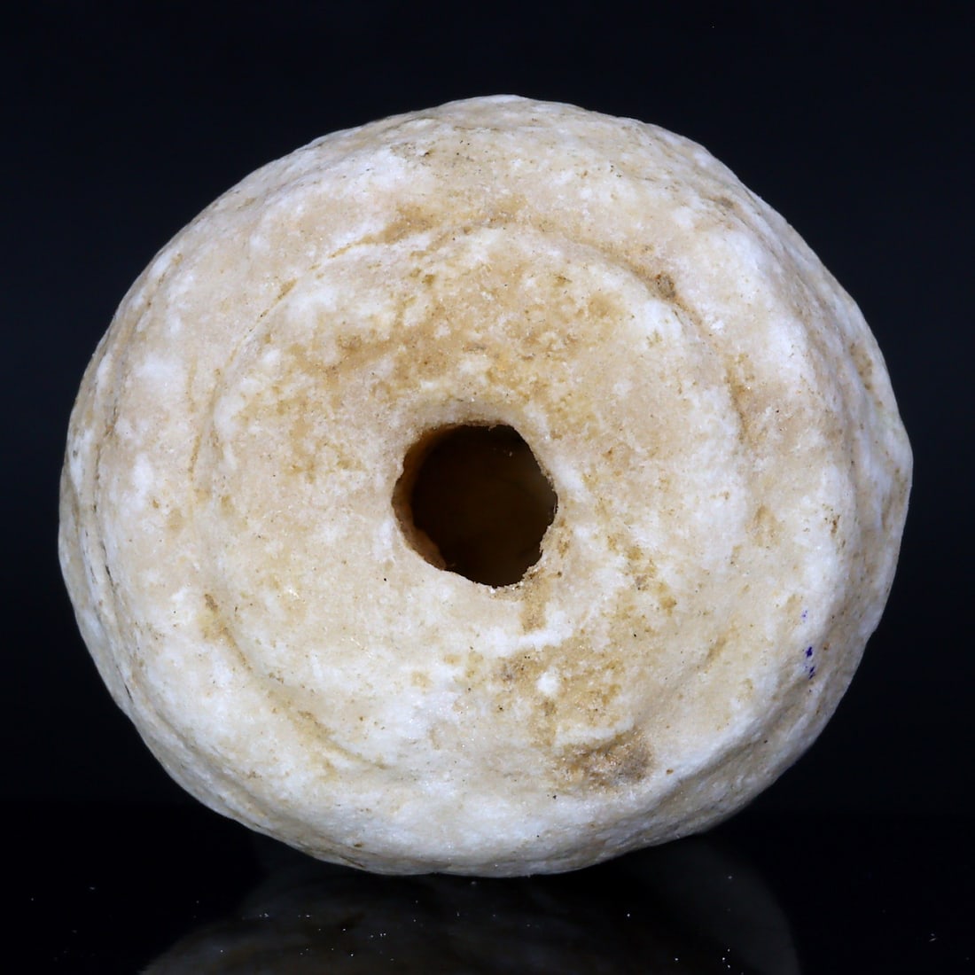 Ancient Convex Cone Disk Alabaster Bead: Emblematic Middle Eastern Artistry (2200 BC-2000 BC): Dimension: 28x26x14mm Rarity Level: Exceptionally Rare Owing to its origin in the ancient Middle East and the exceptional alabaster craftsmanship, this bead stands as a significant historical relic, r