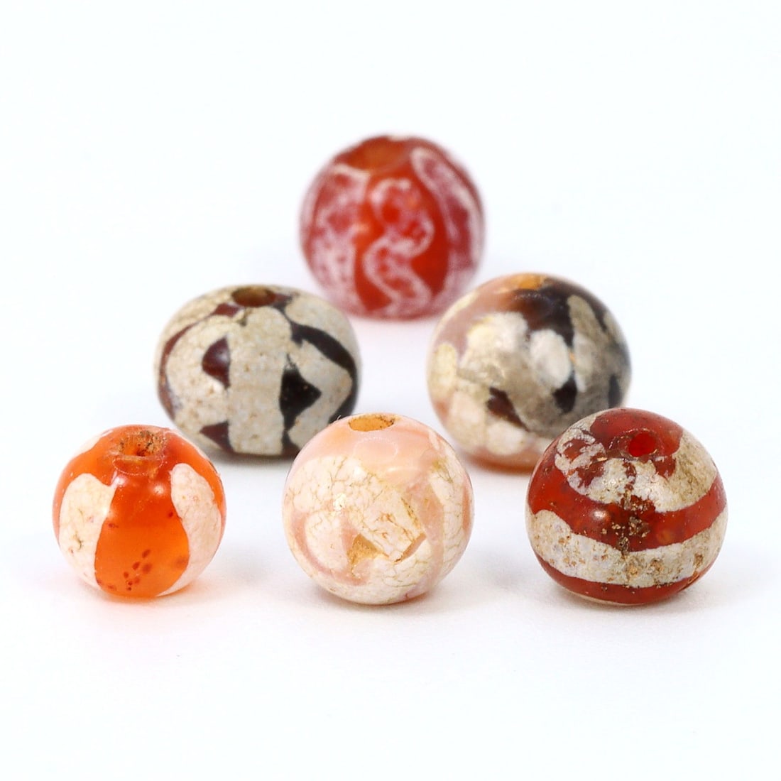 Trade Gem of Ancient Burma: Pyu's Carnelian Bead, 2nd Century BCE - 9th Century CE: Dimension: 5-6.4mm Rarity Level: Highly Rare This bead, stemming from the Pyu era, represents a unique piece of history from an ancient civilization that existed nearly two millennia ago. Estimate: $2