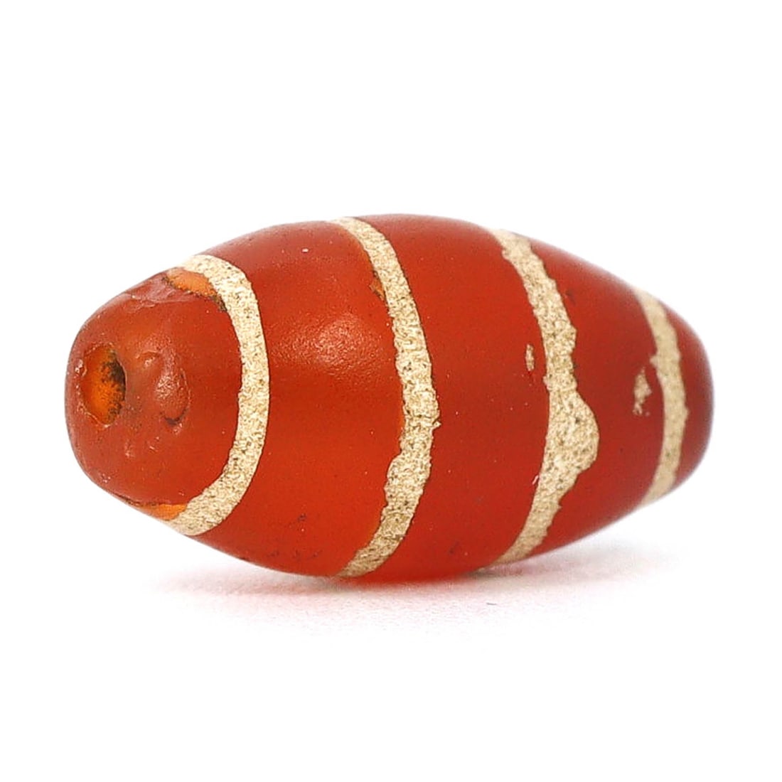 Ancient Himalayan Tibetan Etched 4-Stripe Carnelian Chung Dzi Bead (Circa 8th-11th Century): Dimension: 12.2x6.4mm Introduction: Embark on a historical odyssey with this ancient Tibetan 4-striped Chung Dzi bead, hailing from the enigmatic Medieval Period, specifically dated around the 8th to 
