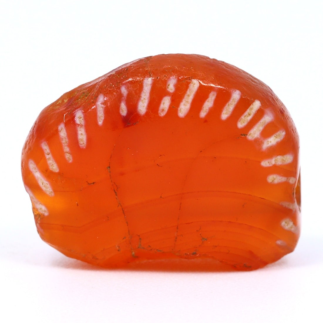 Ancient Etched Carnelian Bead: Radiance of the Kushan Empire (1st-3rd Century AD): Dimension: 14.5x11.7mm Rarity Level: Exceedingly Rare Hailing from the remarkable Kushan Empire of the 1st to 3rd century AD, this etched carnelian bead is a profound symbol of a time marked by afflue
