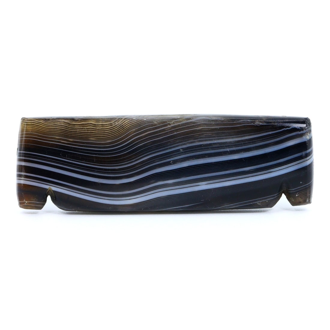Historic Silk Road Era Persian Bow-Shaped Banded Agate Bead (1300-1500 AD): Dimension: 60x19mm Introduction: This bow-shaped banded agate bead is a remarkable representation of the trade and artistry that flourished along the Silk Road from 1300 to 1500 AD. The craftsmanship 