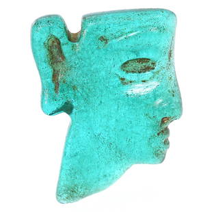 Verdant Byzantine Glass Visage Bead, A Glimpse into Antiquity (500-700 AD): Dimension: 26x19mm Introduction: This exquisite green glass bead, carved in the likeness of a serene human face, hails from the zenith of the Byzantine Empire, between 500 and 700 AD. It reflects the