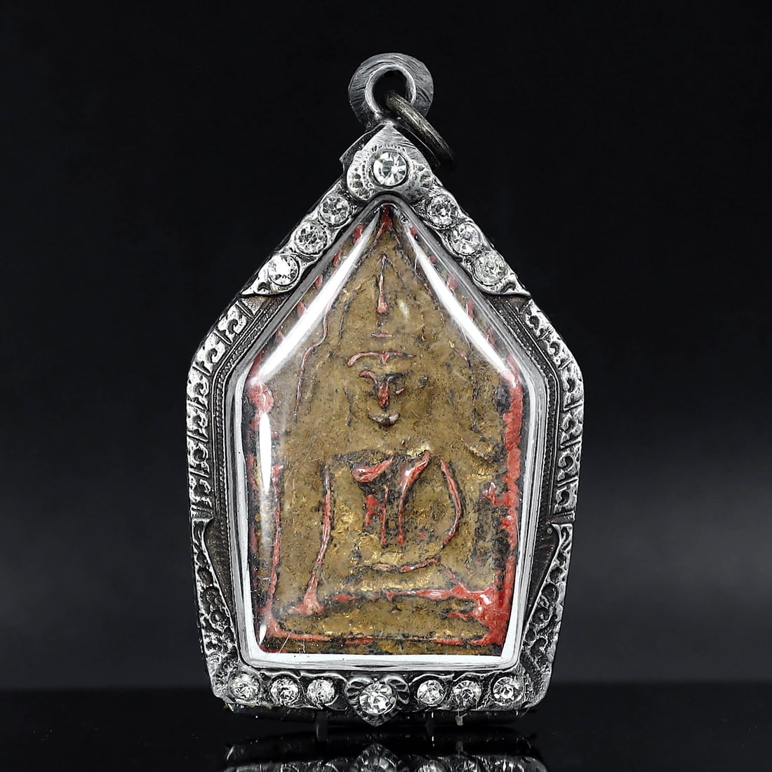 Antique Southeast Asian Buddha Amulet in Vintage Thai Casing (circa early 20th Century): Dimension: 70x40mm Rarity Level: Highly Rare Given its antique grade and the distinctiveness of the vintage Thai casing, this Buddha amulet is a unique representation of Southeast Asian spiritual art 