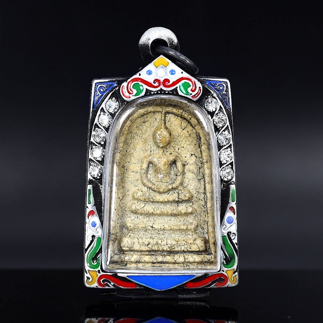 Antique Southeast Asian Buddha Amulet in Vintage Thai Casing (circa early 20th Century): Dimension: 60x35mm Rarity Level: Highly Rare Given its antique grade and the distinctiveness of the vintage Thai casing, this Buddha amulet is a unique representation of Southeast Asian spiritual art 