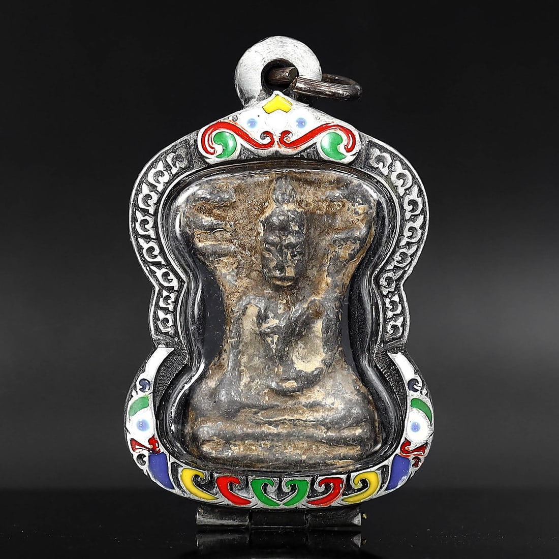 Antique Southeast Asian Buddha Amulet in Vintage Thai Casing (circa early 20th Century): Dimension: 55x35mm Rarity Level: Highly Rare Given its antique grade and the distinctiveness of the vintage Thai casing, this Buddha amulet is a unique representation of Southeast Asian spiritual art 
