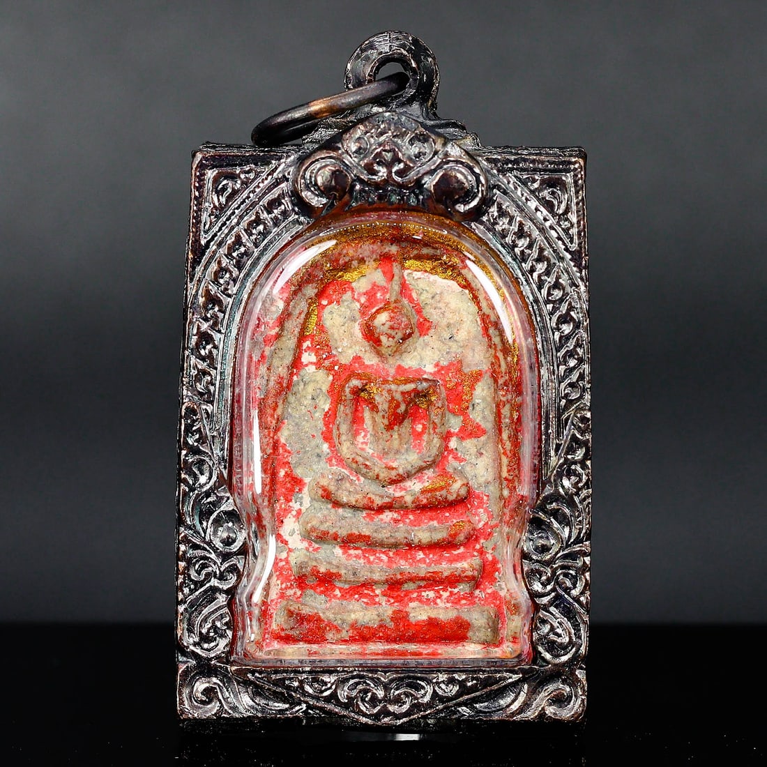 Antique Southeast Asian Buddha Amulet in Vintage Thai Casing (circa early 20th Century): Dimension: 55x30mm Rarity Level: Highly Rare Given its antique grade and the distinctiveness of the vintage Thai casing, this Buddha amulet is a unique representation of Southeast Asian spiritual art 