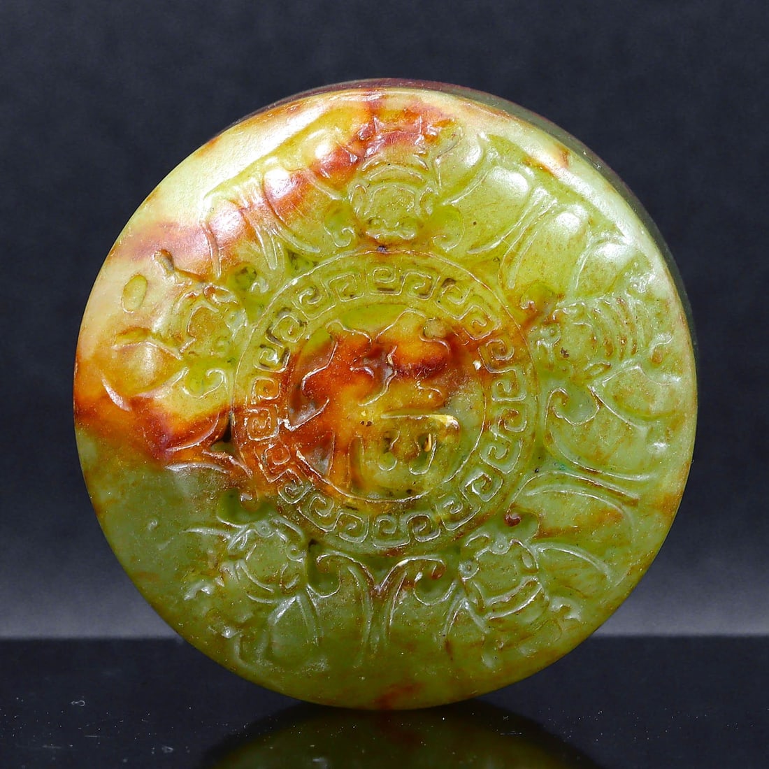 Imperial Shang Dynasty Style Carved Jade Disc with Phoenix: Evoking the elegance of the Shang Dynasty, this jade disc measures 5.5 cm by 2.5 cm (approximately 2.17 inches by 0.98 inches). It is intricately carved with a phoenix, which represents renewal and et