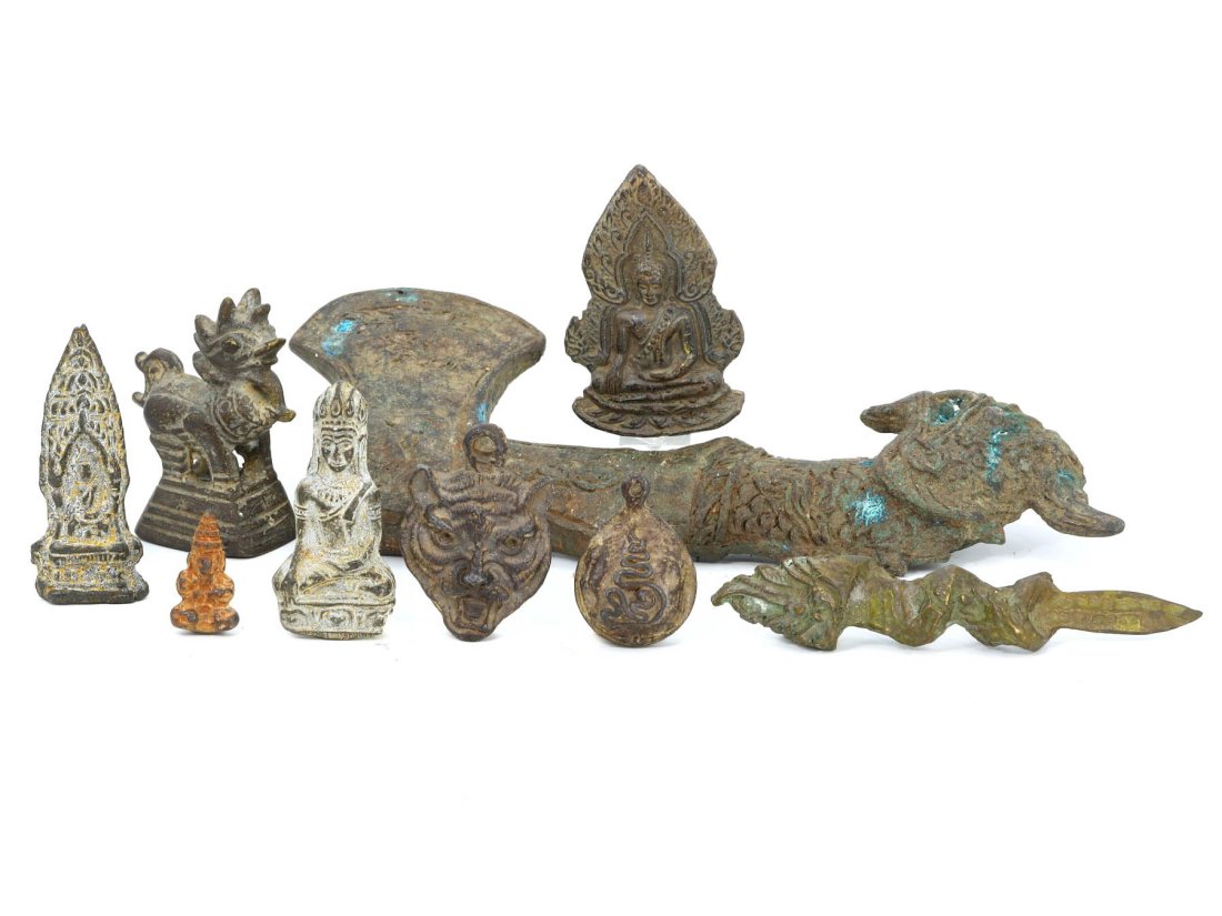 Group of 9 Himalayan & Southeast Asian Antique Bronzes: This collection showcases a fascinating array of nine pieces from the Himalayan and Southeast Asian regions, with the most notable being a sizable axe that measures 20 cm (7.87 inches) in length, 8.5