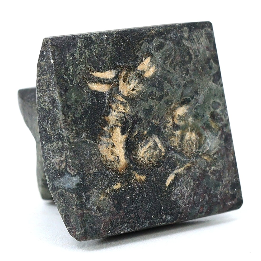 Sasanian Diorite Ibex-Depicting Seal (224-651 AD): A Sasanian-era seal crafted from diorite, distinguished by its square face with two angled loops. It measures 2.5 cm by 2.5 cm, or approximately 0.98 inches square. The seal features an engraving of a