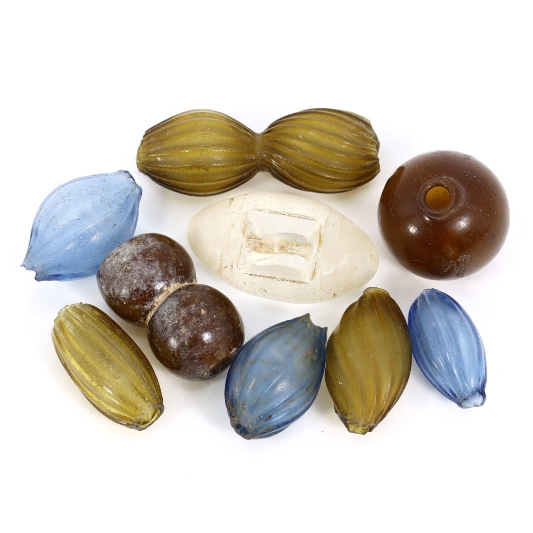 Group of 9 Bohemian Renaissance Blown Glass Beads (14th-17th Century): Featuring a collection of 9 blown glass beads, this lot ranges in size from 15-25mm and originates from the rich cultural tapestry of the Bohemian Renaissance. The craftsmanship displayed in each bead